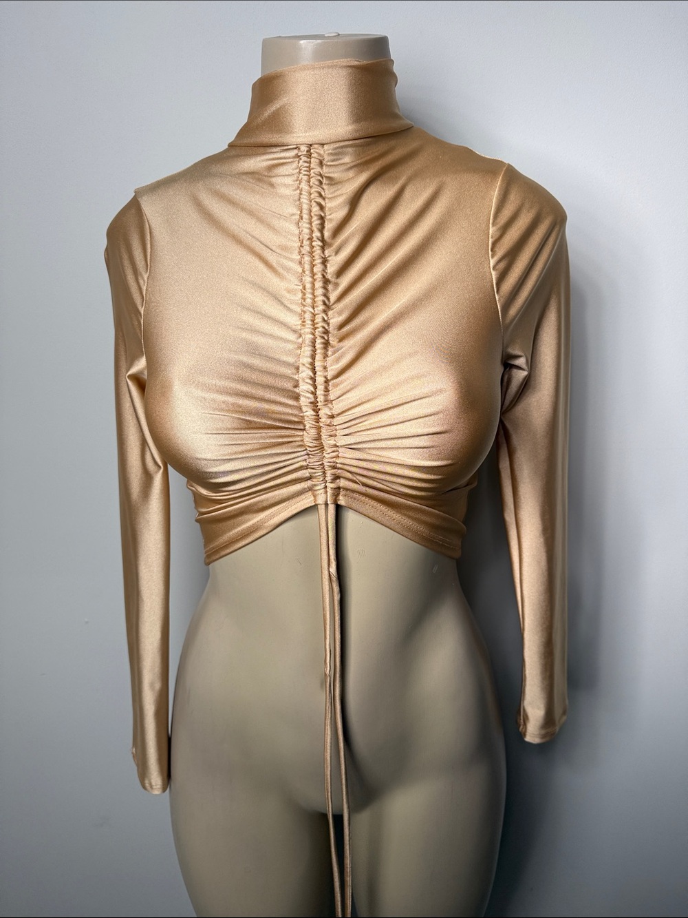 AKIRA Satin Ruched High Neck Long Sleeve Crop Top in Gold